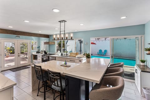 Modern kitchen with plenty of countertop space & bar seating.