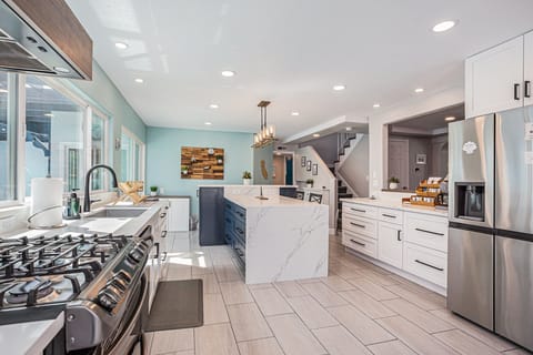 Deluxe range/stove, large fridge, and plenty of open space.