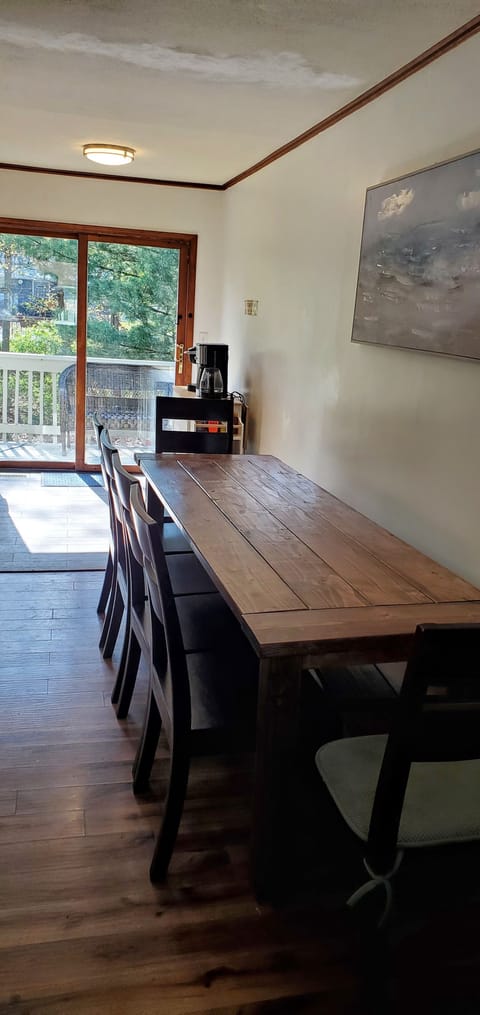 Large table and bench beneath to be pulled out as needed for larger gatherings