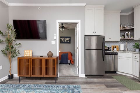 Enjoy endless entertainment with a Smart TV in the living room, offering access to your favorite streaming services for the ultimate relaxation experience.