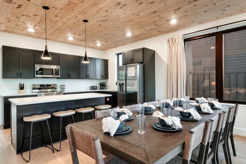 Gather around a stylish table with modern touches and ample seating for memorable feasts!