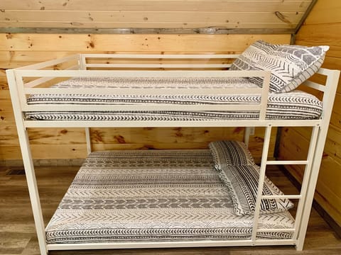 The loft has bunk beds with full size memory foam mattresses.