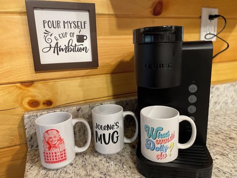 Keurig coffee maker with a starter pack of coffee, tea and hot chocolate.