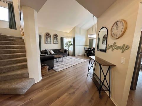 Welcome to our home! A spacious common area with vaulted ceilings greets you.