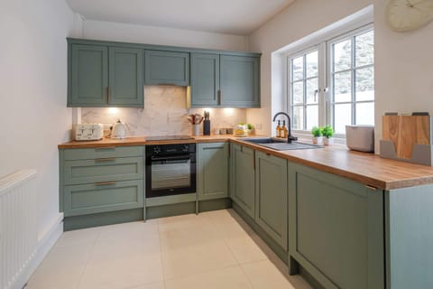 This kitchen includes an oven and hob, microwave, fridge freezer, dishwasher, washer dryer, coffee machine, toaster, and kettle. With these modern appliances, you'll have everything you need to prepare delicious meals and enjoy the comforts of home.