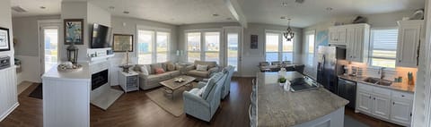 Panoramic view of entry, living, dining, and kitchen.