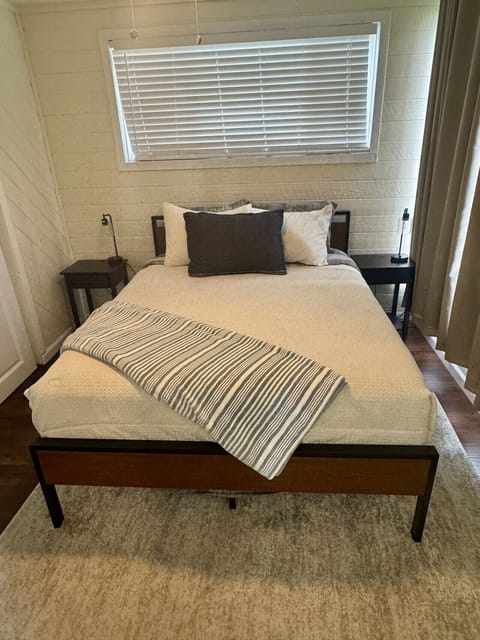 Bedroom #2 located on the main floor with a queen sized bed