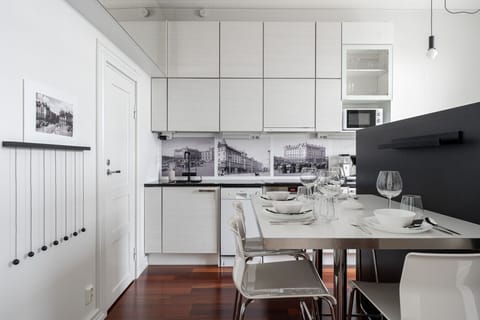 The kitchen is fully equipped with all the necessary appliances for a convenient stay.