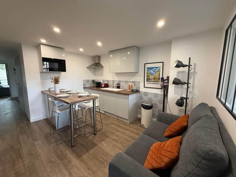 living room, dining table, tv, sofa, kitchen