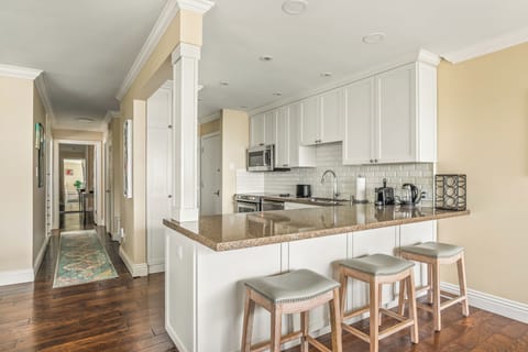 Bright and spacious kitchen, fully equipped for effortless coastal dining experiences.