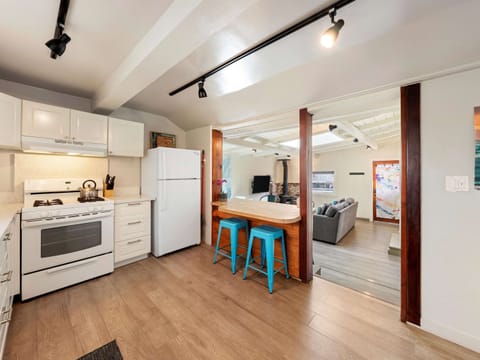 The airy kitchen offers ample space & all the comforts of home