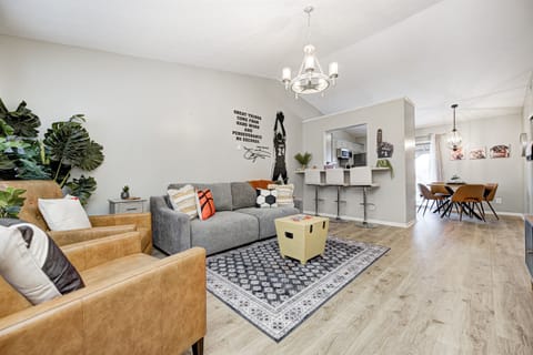 Open concept living room flows easily into the dining and kitchen space