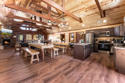 Fully equipped chef’s kitchen with granite countertops and bar seating.