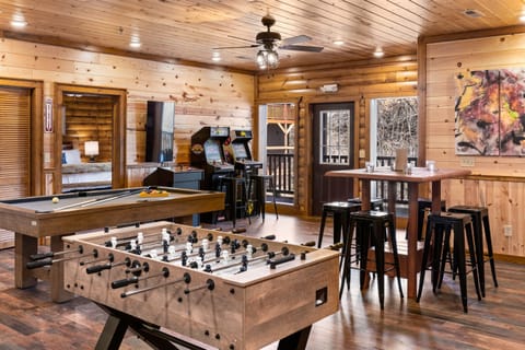 Fun-filled game room with arcades, pool table, and foosball!