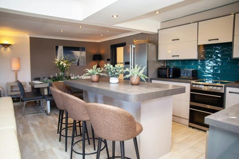 Kitchen with breakfast bar and stools