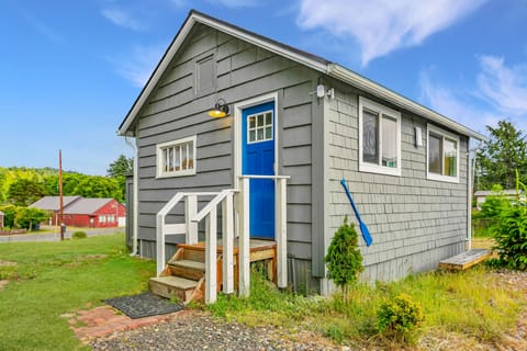 Charming cottage exterior with a welcoming entry and coastal feel