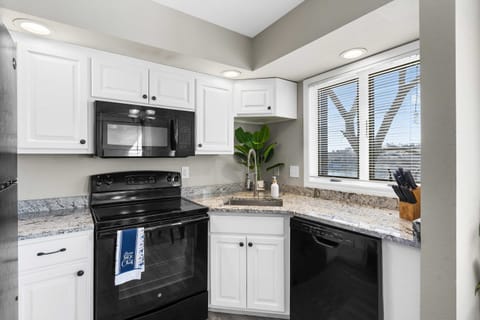 The open, airy kitchen offers ample space & every home comfort