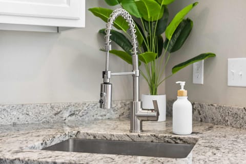 The open, airy kitchen offers ample space & every home comfort