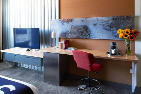 Kick back with big-screen entertainment and an easy work setup.