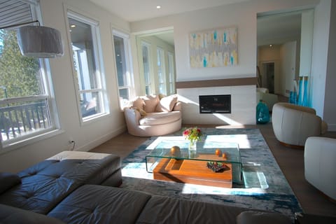 Spacious, sunlit living room with cozy vibes, perfect for relaxing