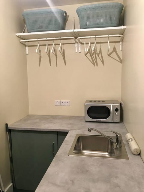 Laundry room with washer/dryer, microwave, freezer and USB charging points