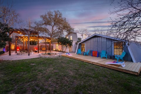 Enjoy the expansive back yard filled with games and a fire pit