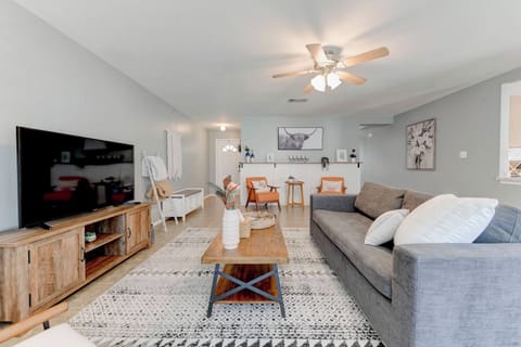 Kickback and watch your favorite shows on our 55" Roku TV