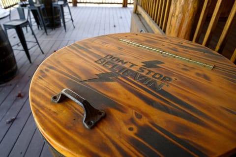 Outdoor Lounge: Enjoy your drinks by the fire with this unique, engraved wood ice chest!