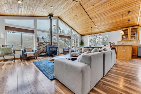 Living room: Wood-burning fireplace, Smart TV, foosball table, piano