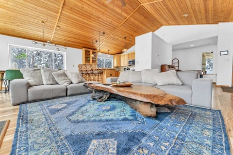 Living room: Wood-burning fireplace, Smart TV, foosball table, piano