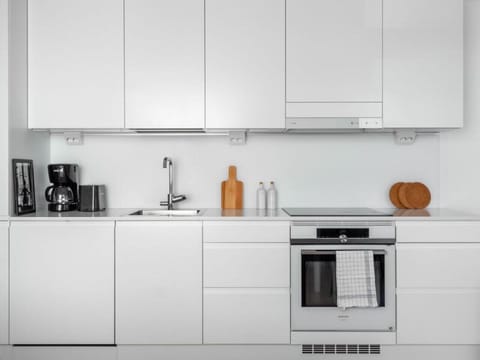 The kitchen is well equipped with cooking ware.