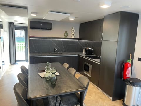 Furniture, Interior Design, Flooring, Countertop, Kitchen, Floor, Wood, Ceiling, Lighting, Cabinetry