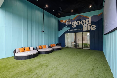 Kick off your shoes and get cozy in our outdoor movie room with 200" movie screen.