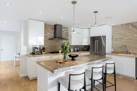 Additional barstool seating at the kitchen island.