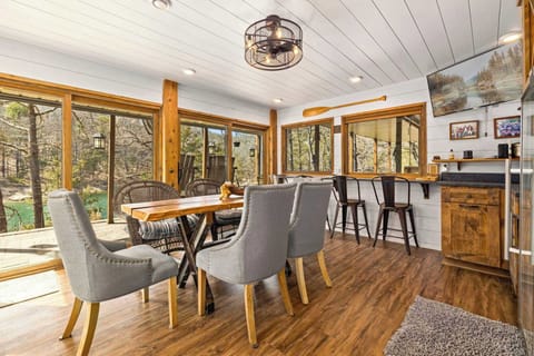 An additional dining area featuring a spacious table for 6, complemented by 4 extra chairs for flexible seating and gatherings.