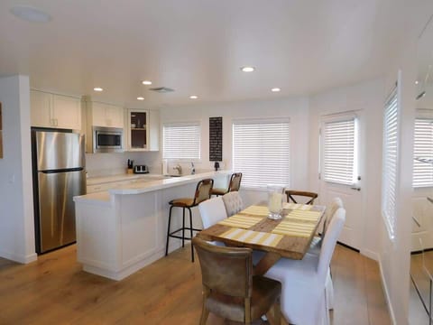 Dining room looking towards the kitchen with a nice large breakfast bar.