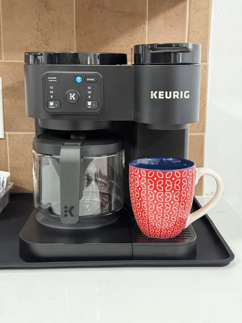 Make a cup of coffee with either a carafe or single cup option available.