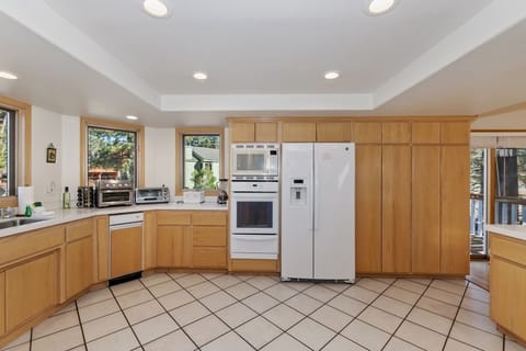 Bright and spacious kitchen with ample counter space, modern appliances, and beautiful natural light pouring in through the windows