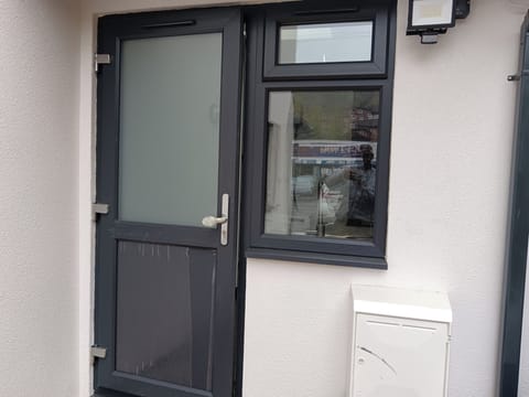 Private side entrance with front parking for one car, night floodlight and plenty of outside space.