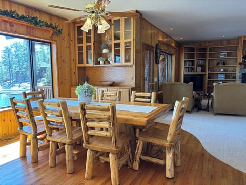Hand crafted dining room table seats 8 and has beautiful lake views