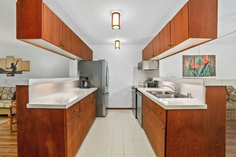 Simple yet stylish kitchen with upgraded appliances for modern living.