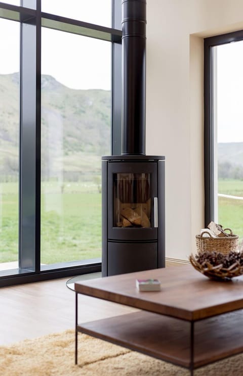 Furniture, Flooring, Floor, Wood Flooring, Wood-Burning Stove, Hardwood, Living Room, Wood Stain, Chair, Hearth