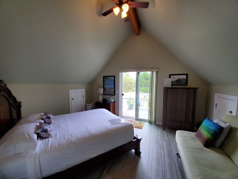 Rear bedroom w/ queen medium-firm pillowtop mattress, armoire, and Eurolounger