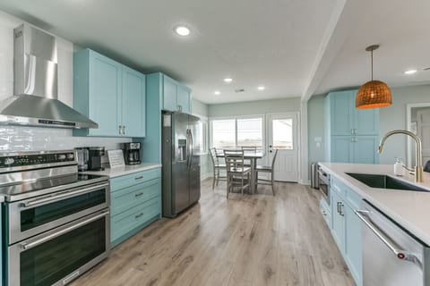 Spacious kitchen for cooking for a crowd of people with room for many hands to help cook. (Upstairs)