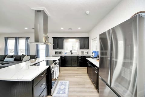 Not only is the kitchen functional, but it's beautiful too. It comes with all brand new stainless appliances, countertops, & flooring. 