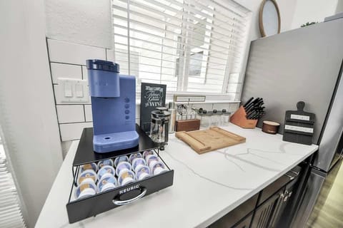 Enjoy a coffee on us! Just pick your favorite flavor from the tray below. This area also includes a corkscrew, shakers, & all the things for mixing up your favorite cocktail. A brand new knife set is also included to make life easier :)