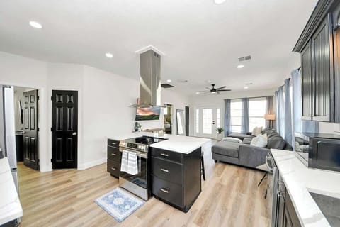 The newly remodeled kitchen comes with everything needed for whipping up your favorite meals. The island has plenty of counter space for prepping, cooking, & serving up family faves! The open flow makes this a great space for entertaining. 