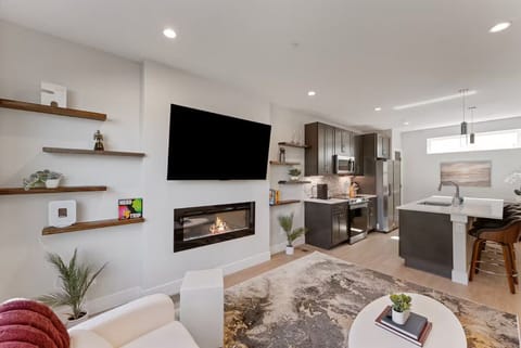 Artful decor, plush seating, and thoughtful design make this welcoming space the heart of the home.