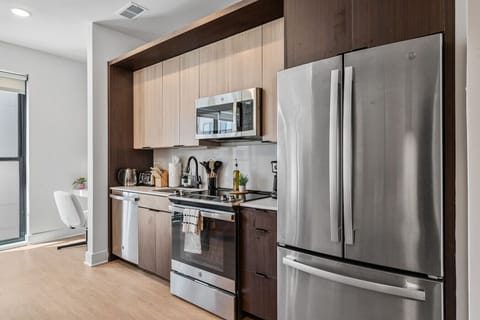 Designer kitchen with stainless steel appliances and workspace 🍴