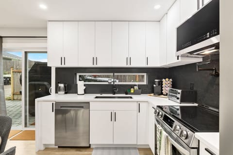 Cook dinner or make coffee—kitchen includes high-end appliances and plenty of counter space.